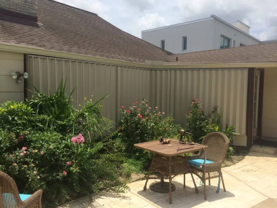 Accordion shutters closed around the same Clear Lake area garden patio