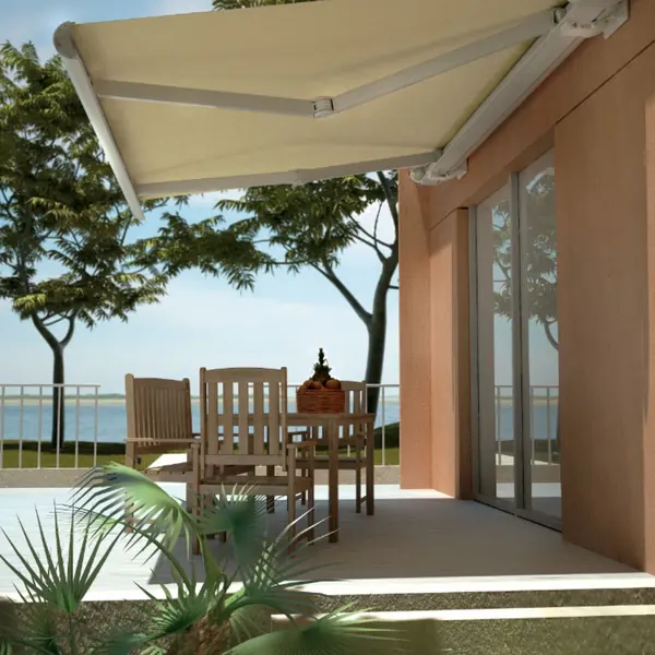 white retractable awning over table and chairs on patio