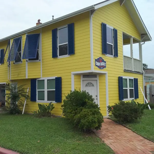 Blue shutters on a yellow home