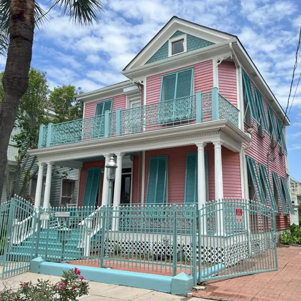 Light blue shutters on a pink house